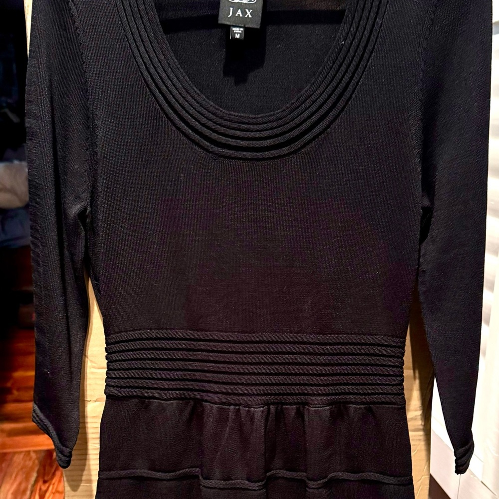 Black sweater dress, below the knee.